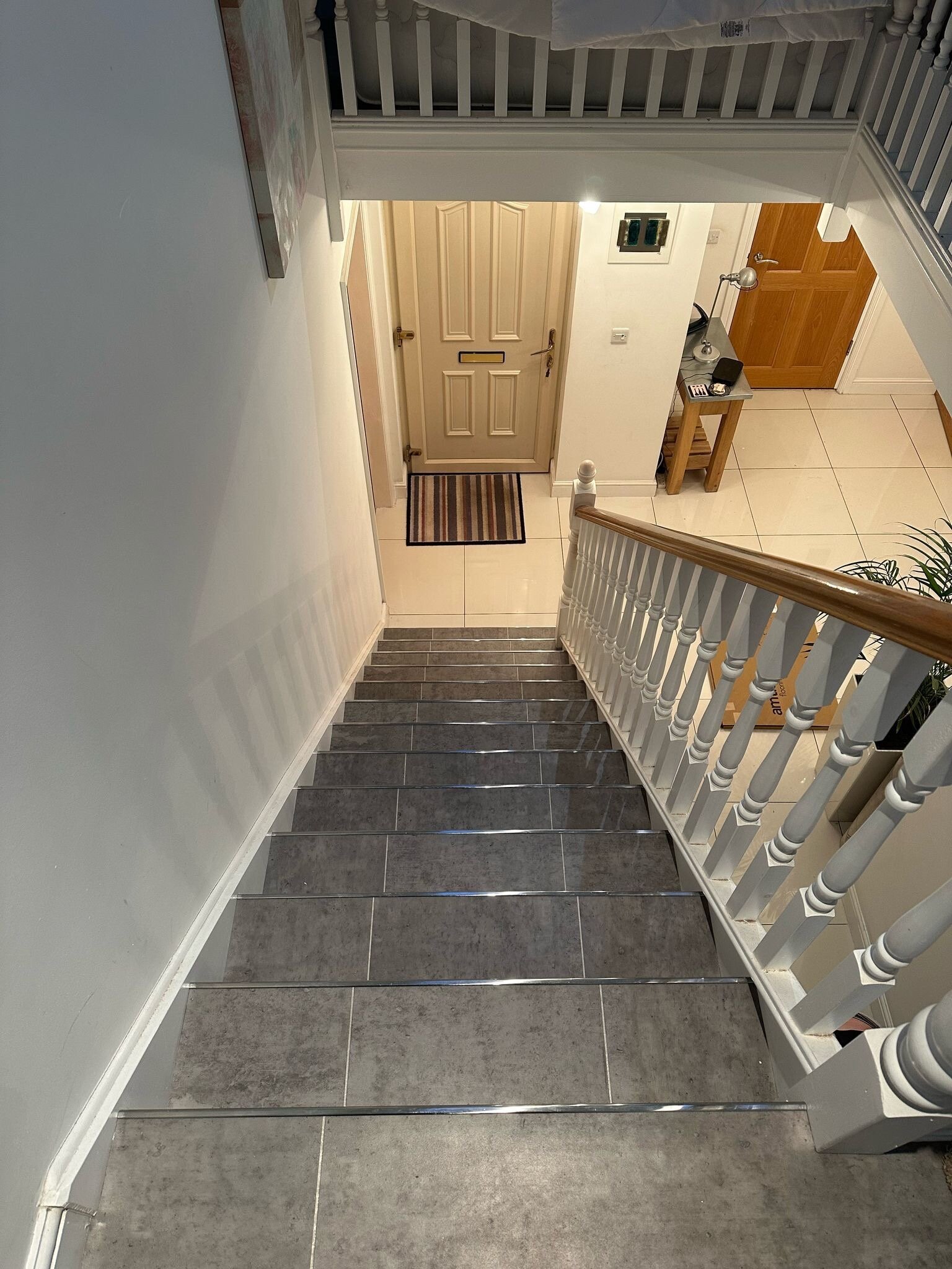 Amtico Signature tile in Exposed Concrete with brushed chrome nosings