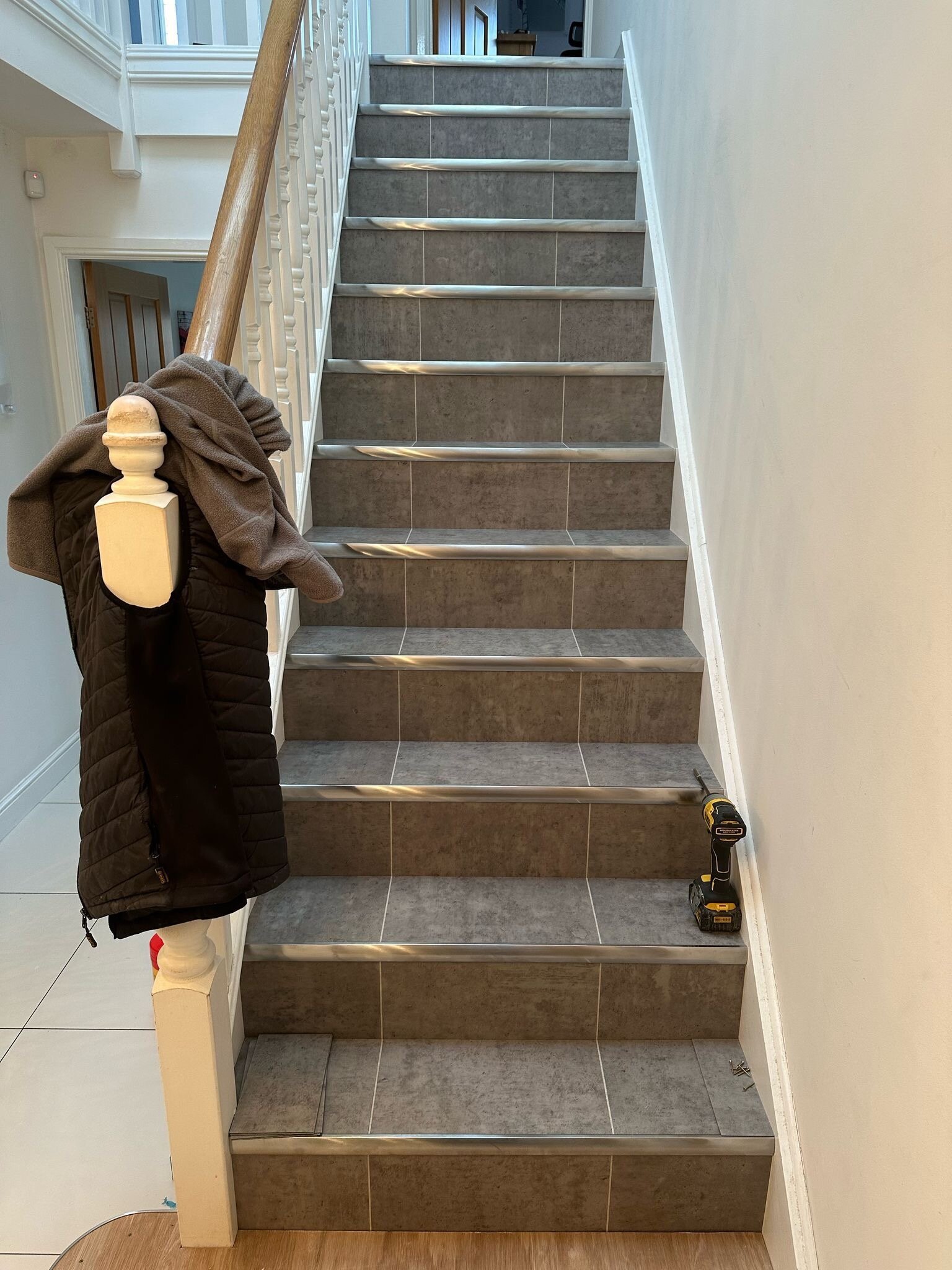 Amtico Signature tile in Exposed Concrete with brushed chrome nosings