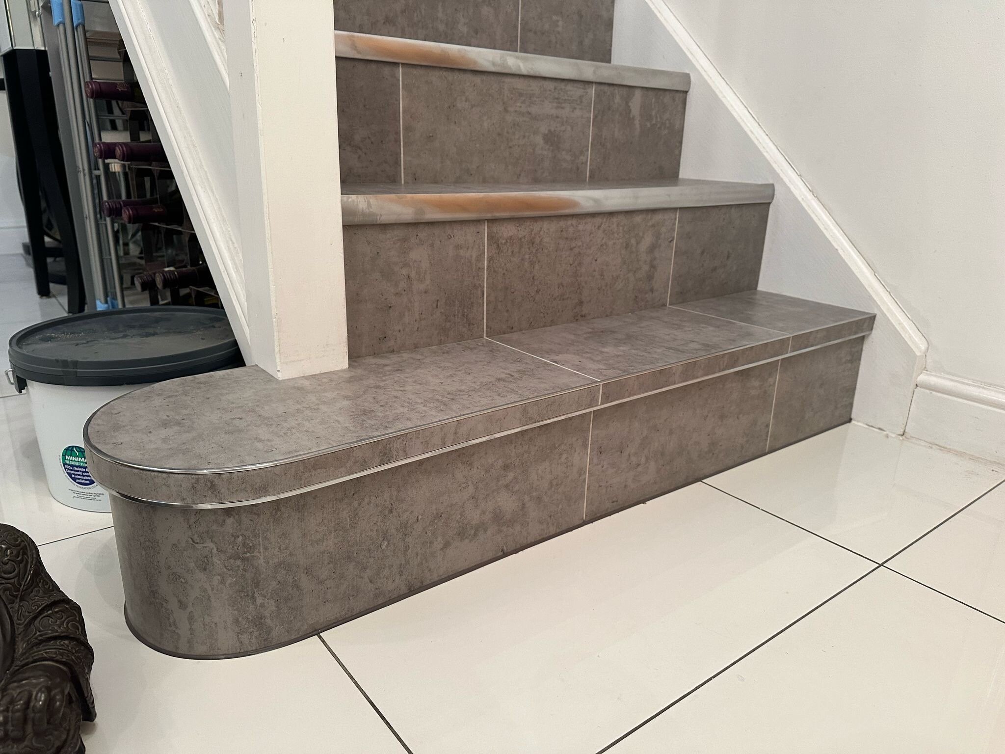 Amtico Signature tile in Exposed Concrete with brushed chrome nosings